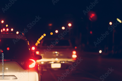 Blur image of traffic cars on the road at night.