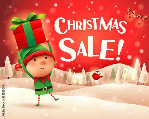 Merry Christmas! Cheerful snowman holds wooden board sign in Christmas snow scene winter landscape.