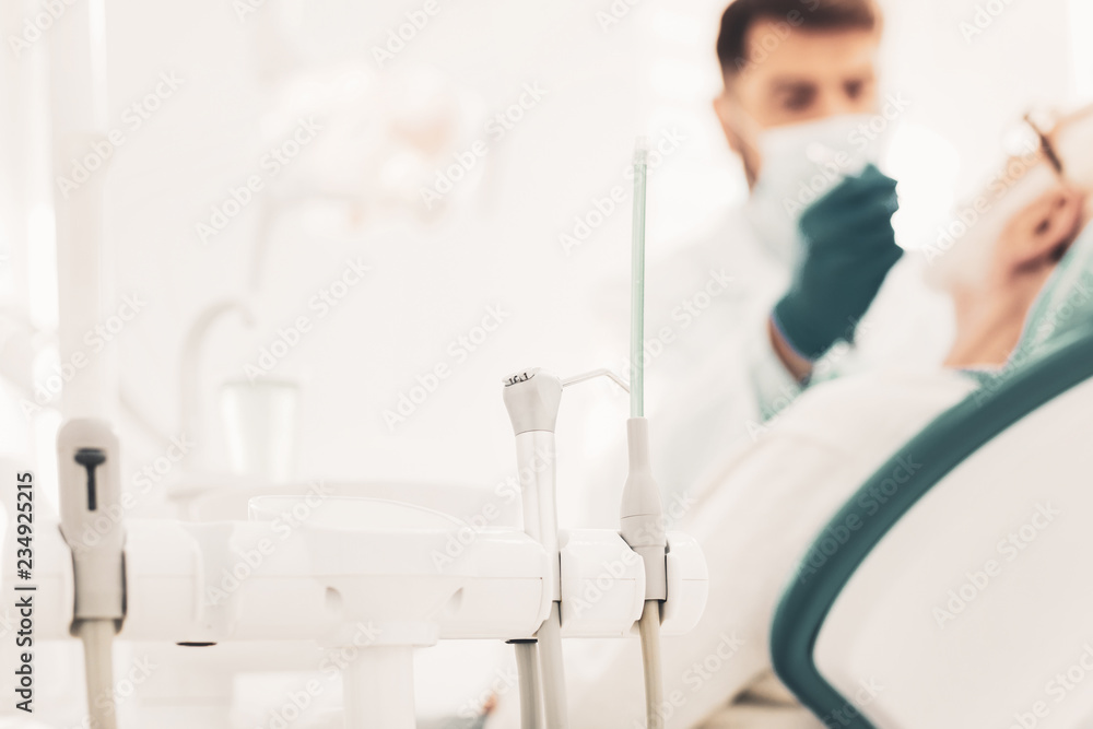 Close up of stand with modern dental instruments