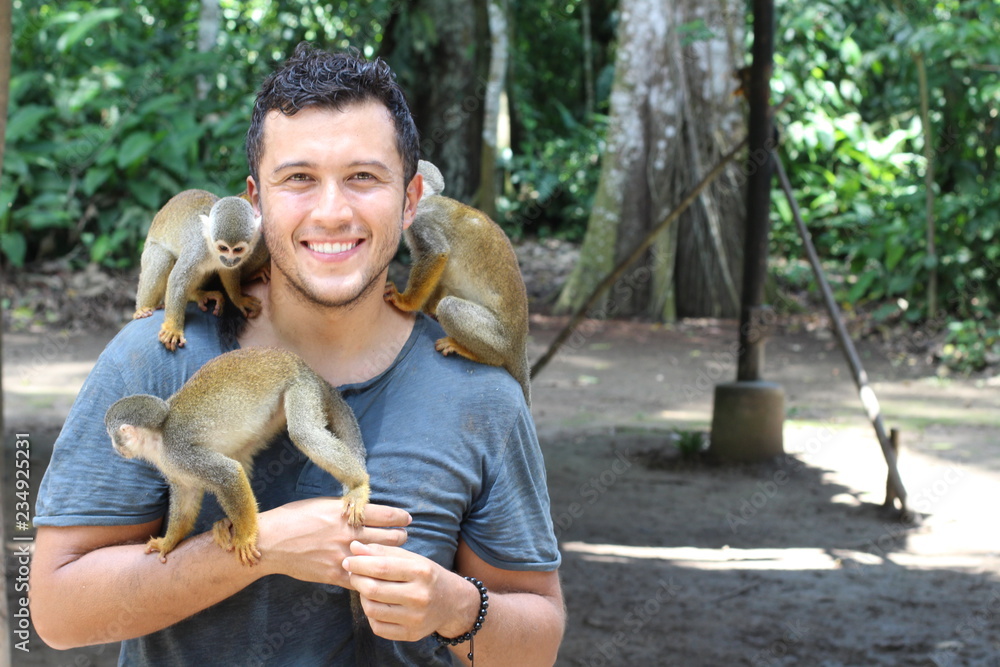 Fototapeta premium Titi monkeys and its trainer