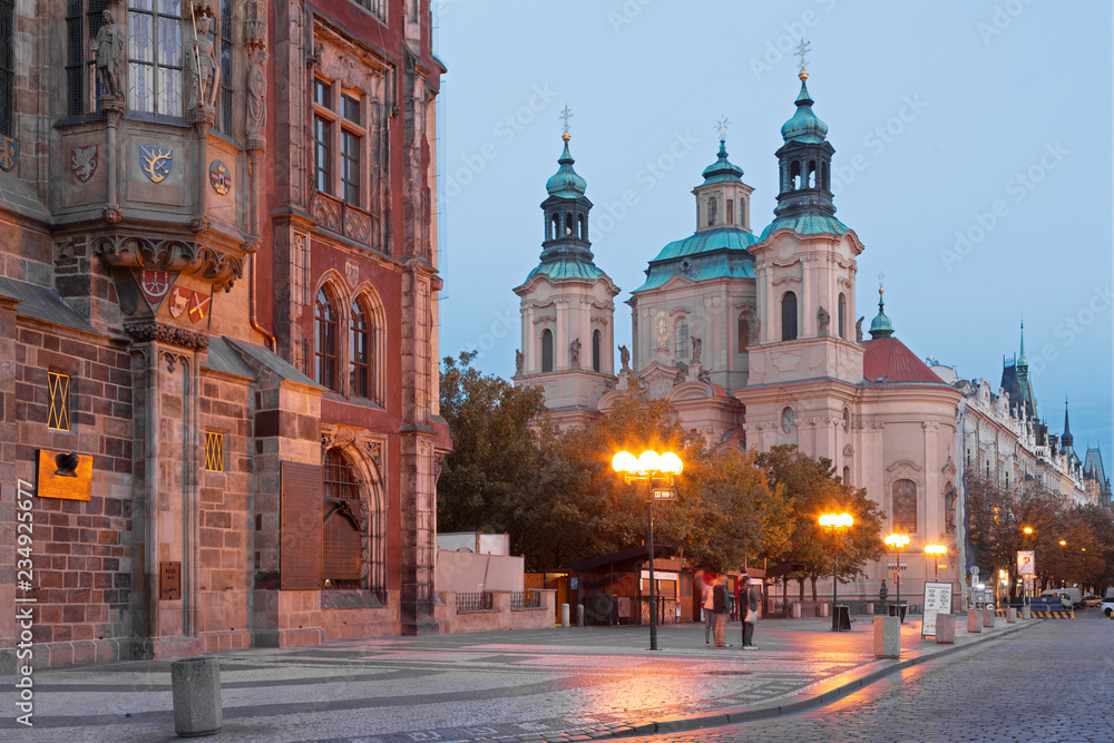 Prague - The Old Town hall, Orloj, Staromestske square and St. Nicholas church at dusk.