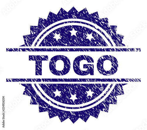 TOGO stamp seal watermark with distress style. Blue vector rubber print of TOGO label with dirty texture.