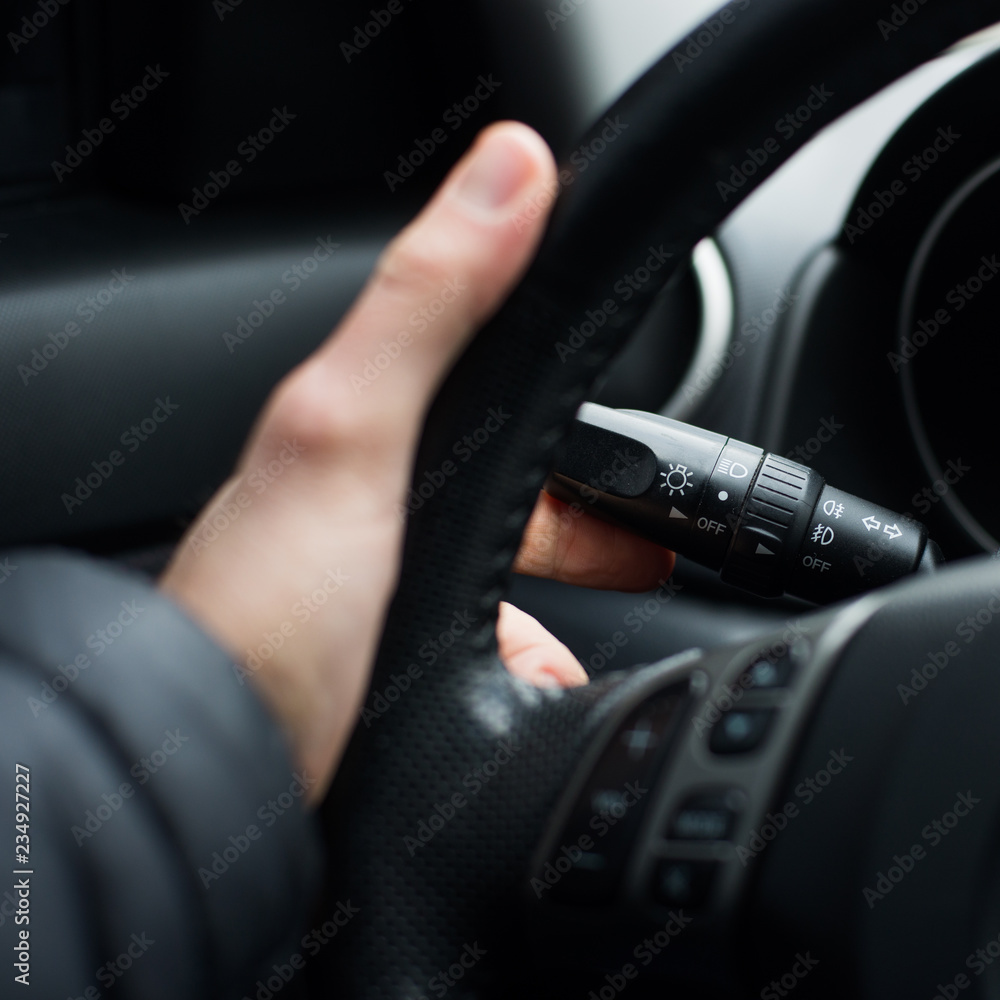 Hand on the steering wheel, close-up