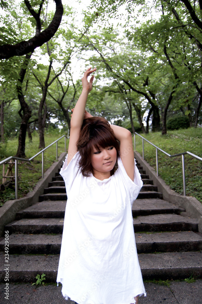Asian female model poses for pictures in the nature Asian female model poses for pictures in the nature