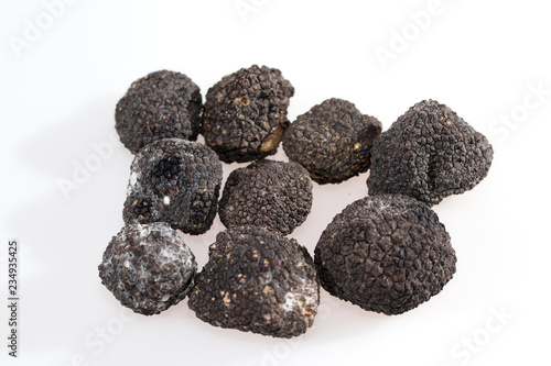 Black truffles isolated on a white background. © davit85