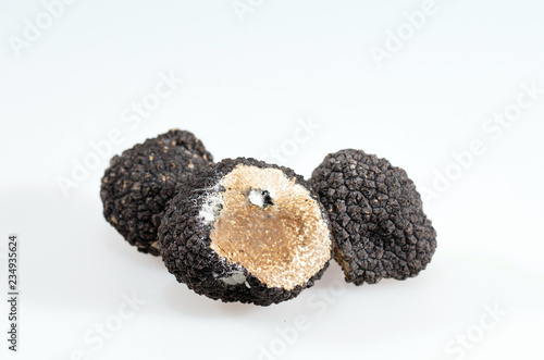 Black truffles isolated on a white background. © davit85