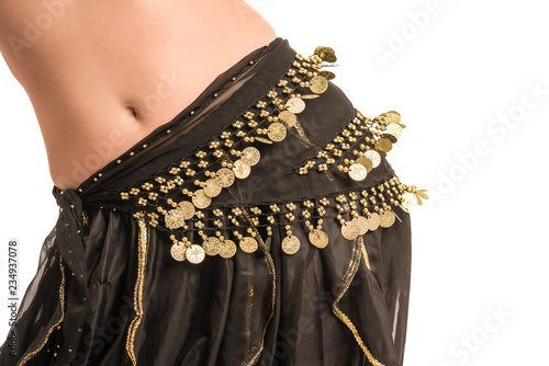 Beautiful belly dancer young woman in gorgeous black costume dress. Part of body
