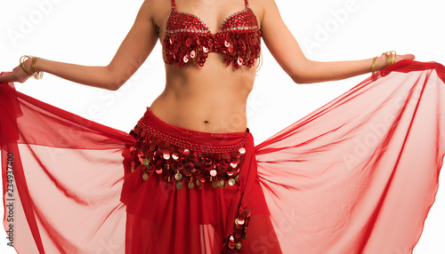 Bild auf Leinwand Beautiful belly dancer young woman in gorgeous red and gold costume dress
