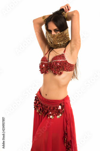 Fotografie Beautiful belly dancer young woman in gorgeous red and gold costume dress