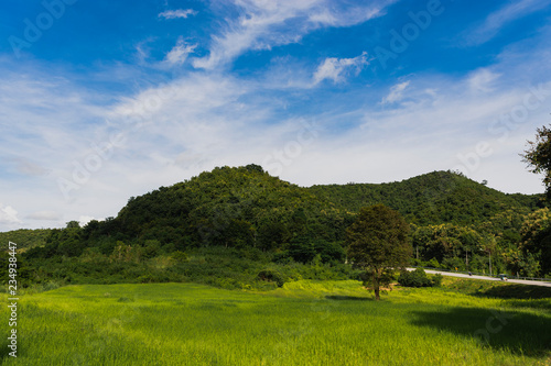 Summer landscape in mountains and the dark blue sky with clouds. Khlong Lan Kamphaeng Phet Thailand.
