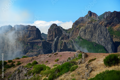 Mountain range on Pico do Arieiro against blue sky