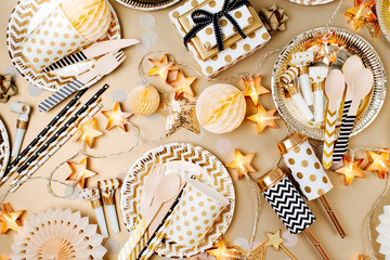 Accessories for children's parties in Gold  color. Flat lay, top view