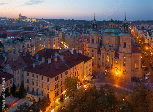 Prague - The St. Nicholas church, Staromestske square and Old Town at dusk.