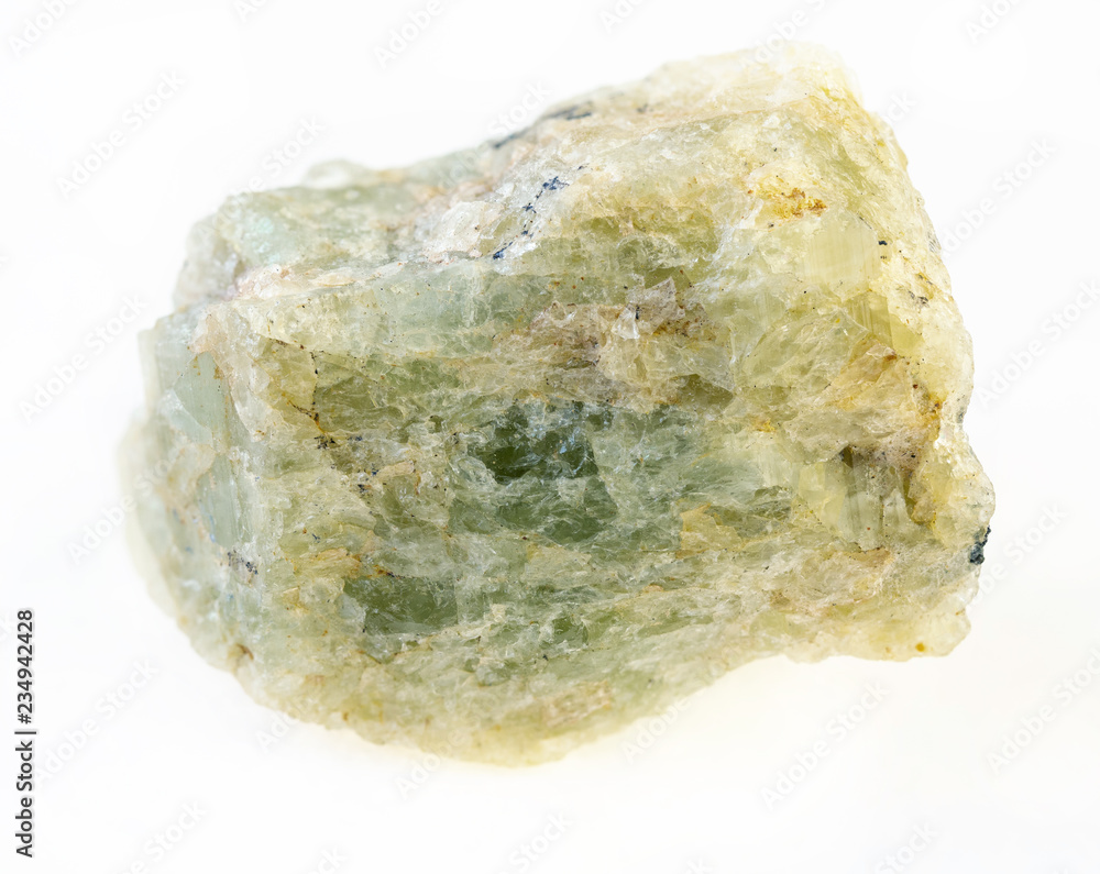 raw green beryl (chrysoberyl) stone on white