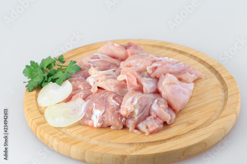 raw chicken goulash on white background