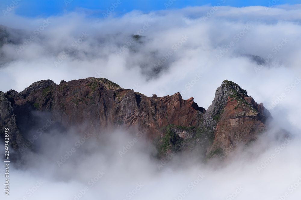 Rock formation in dense clouds on Pico do Arieiro on Portuguese island of Madeira