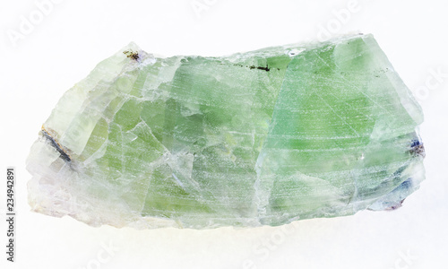rough green Beryl crystal on white