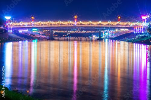 Beautiful light on the Nan River at night on the bridge (Naresuan Bridge) in day The Loy Krathong festival in Phitsanulok City, Thailand.