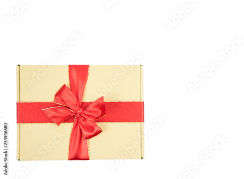Gift box and red ribbon with copy space on isolated white background. © Suphansa
