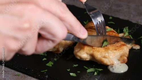 Eating with fork and knife cordon bleu food