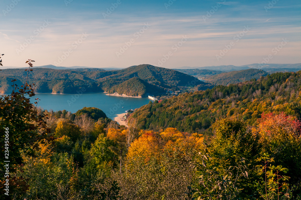 Obraz premium Solina Lake, Bieszczady, Poland. Views from hill to lake in sunny autumn day