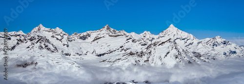 Snow winter at top of mountains, Swiss Alps at sunny day. Panorama view with beautiful blue sky. Zermatt, Switzerland © metha275