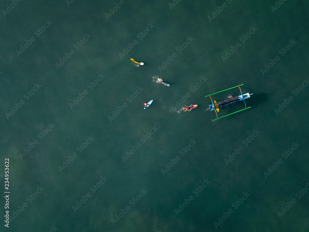 Indonesia, Bali, Kuta beach, Aerial view of surfers Indonesia, Bali, Kuta beach, Aerial view of surfers