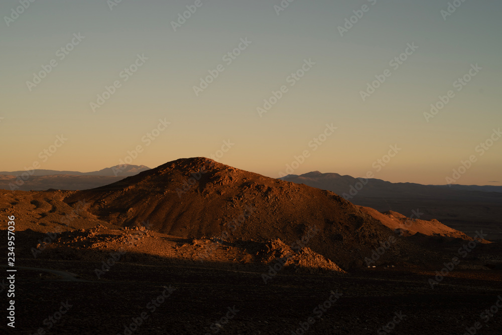 golden morning light on red earth hill, mountains, Eastern Sierra Nevada, California, USA golden morning light on red earth hill, mountains, Eastern Sierra Nevada, California, USA