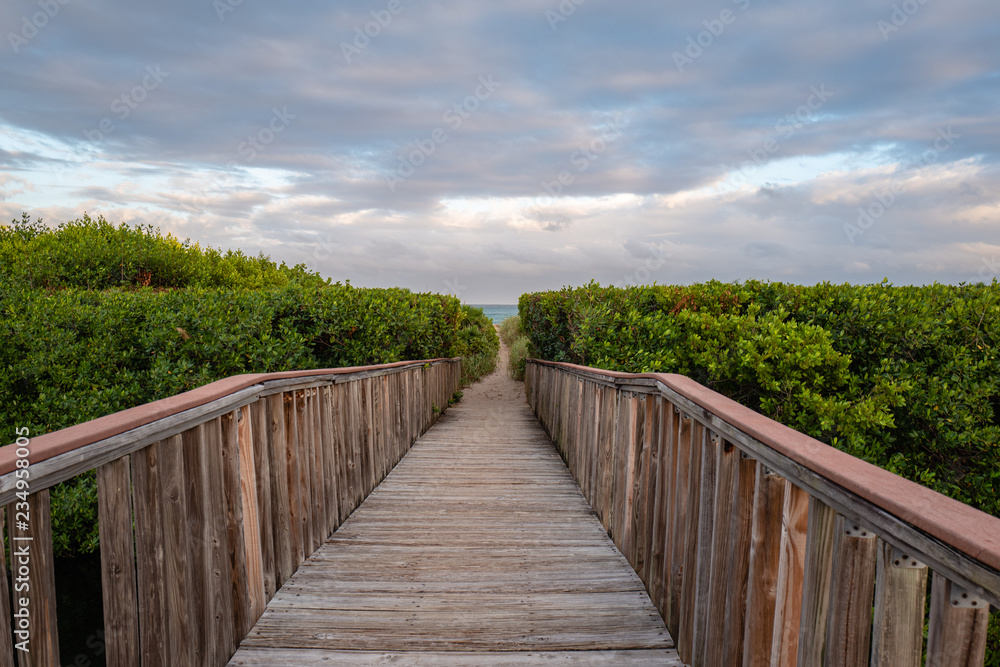 wooden bridge at pompano beach with beach access