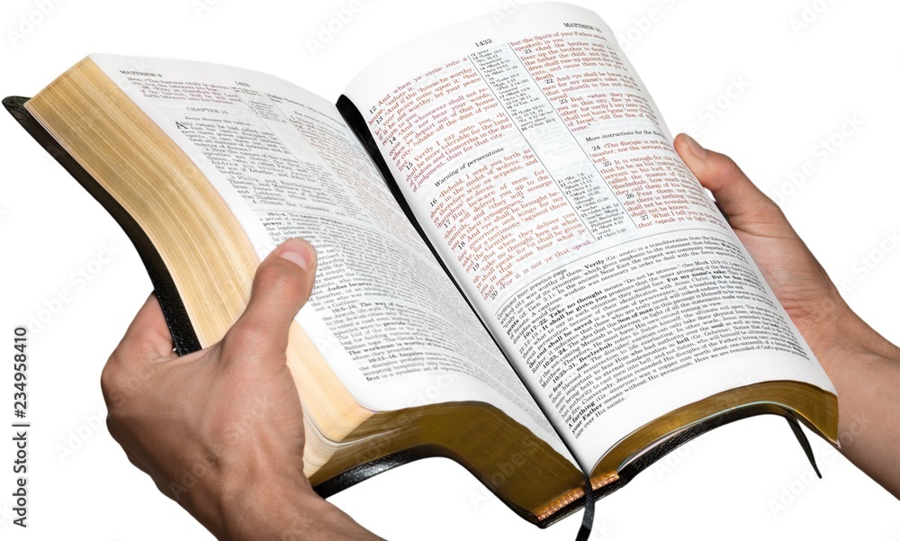 Closeup on Hands Holding an Open Bible Closeup on Hands Holding an Open Bible