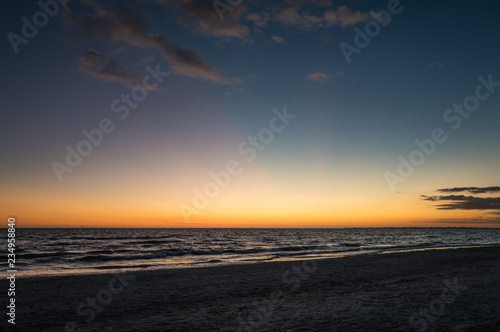 sunset on the beach with warm light © Dirk