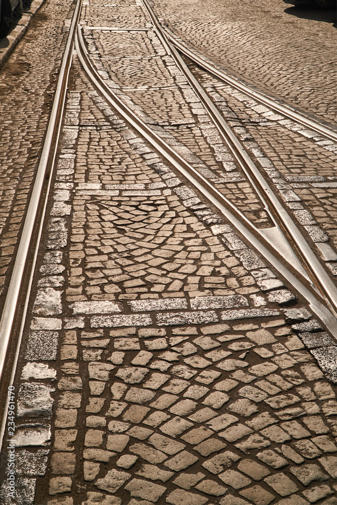 Obraz premium Crossroads tram tracks on a cobbled street in Poznan.
