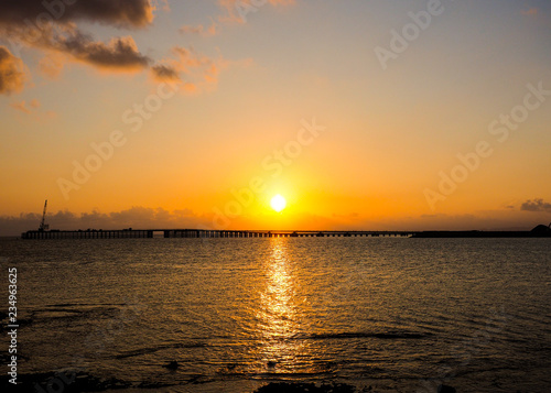 Sunlight  The sun rises over the sea of sunset background