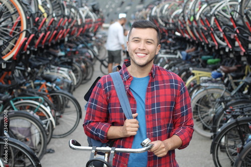 Joyful ethnic man in bicycle 3D parking lot