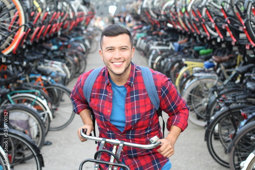 Joyful ethnic man in bicycle 3D parking lot