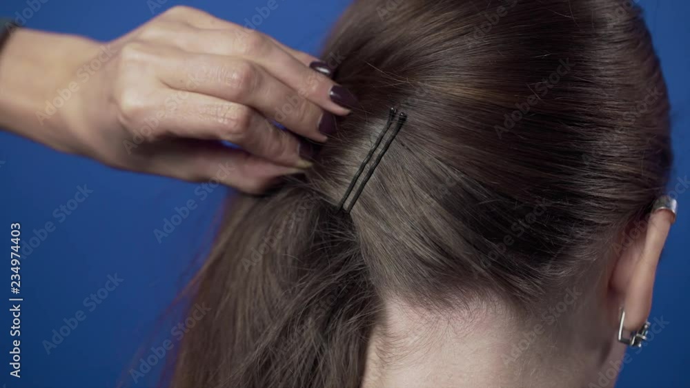 Process of making the hairstyle at the hairdresser, hair stylist makes the hairstyle for her client, making of the hairstyle at the beauty salon Process of making the hairstyle at the hairdresser, hair stylist makes the hairstyle for her client, making of the hairstyle at the beauty salon