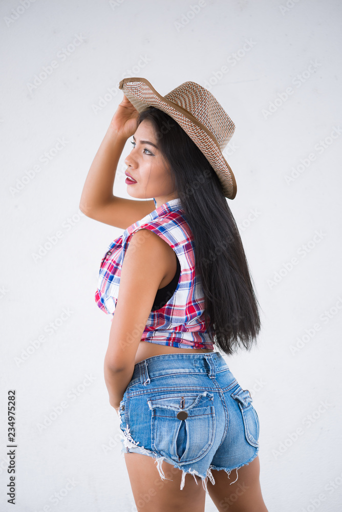 Portrait of asian sexy woman in cowgirl style pose for take a photo,Beauty and fashion concept Portrait of asian sexy woman in cowgirl style pose for take a photo,Beauty and fashion concept