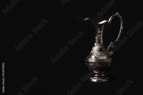 silver jug of the Eastern black background