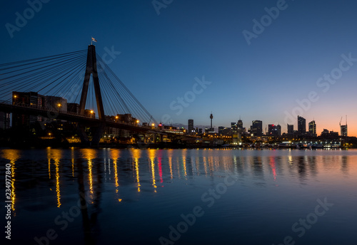 ANZAC Bridge and Sydney city skyline at dawn