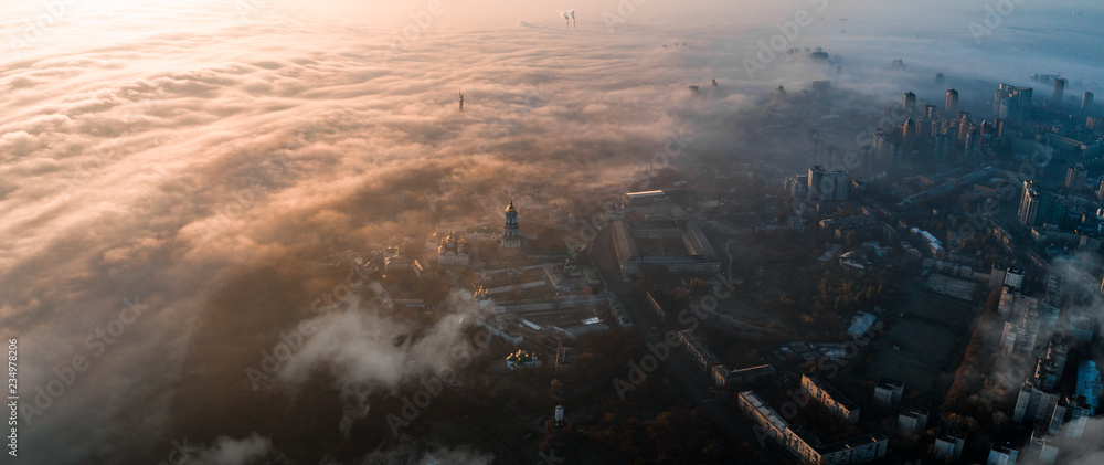 Aerial view of the city in dense fog - obrazy, fototapety, plakaty 