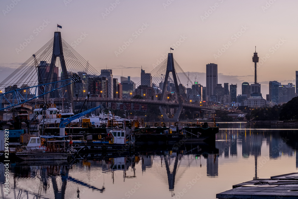 Sydney's ANZAC Bridge and city backdrop at dawn
