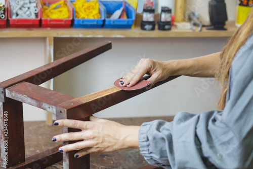 woman restoring furniture