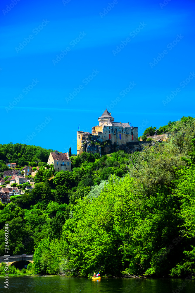 A view of the medieval fortress of Castelnaud La Chapelle high above the Dordogne River in Aquitaine, France