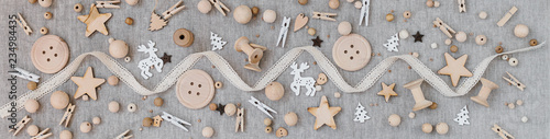 Craft and wooden Christmas flatlay on farbic background. photo