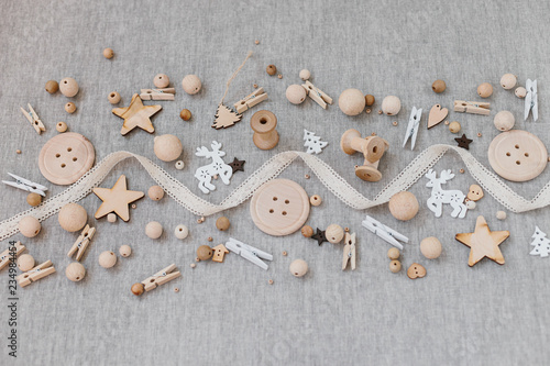 Craft and wooden Christmas flatlay on farbic background. photo