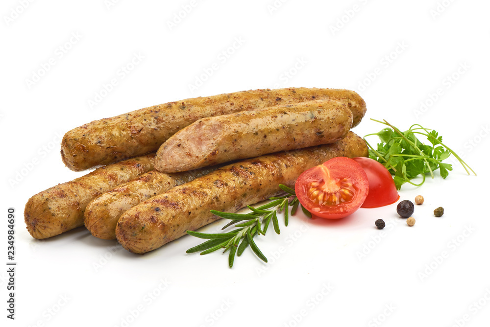 Grilled German Thin Sausages with herbs, pepper and tomatoes, isolated on a white background. Close-up Grilled German Thin Sausages with herbs, pepper and tomatoes, isolated on a white background. Close-up