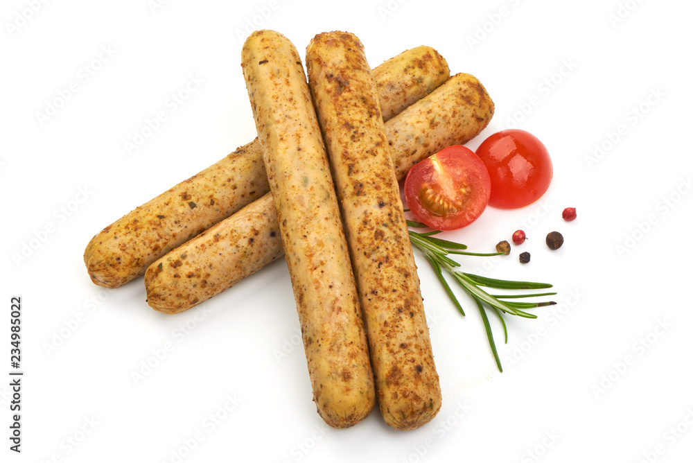 Grilled German Thin Sausages with herbs, pepper and tomatoes, isolated on a white background. Close-up Grilled German Thin Sausages with herbs, pepper and tomatoes, isolated on a white background. Close-up