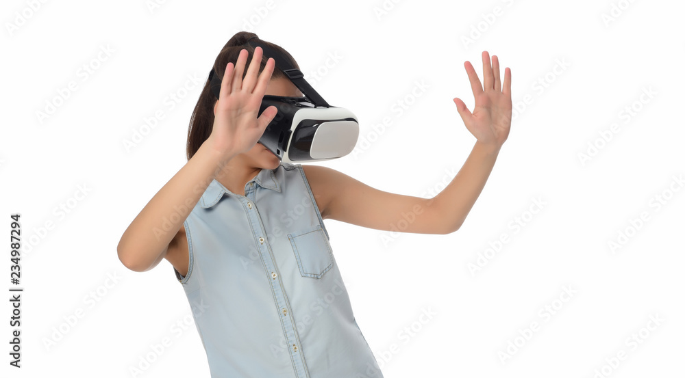 Young woman in virtual reality (VR) glasses holding tablet. Isolated on white background Young woman in virtual reality (VR) glasses holding tablet. Isolated on white background