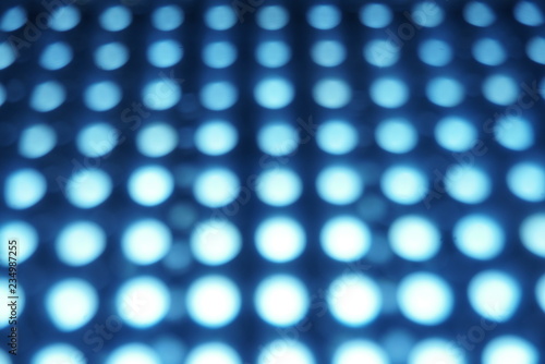 led panel in fluorescent light blurred background