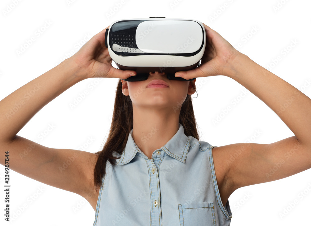 Young woman in virtual reality (VR) glasses holding tablet. Isolated on white background Young woman in virtual reality (VR) glasses holding tablet. Isolated on white background